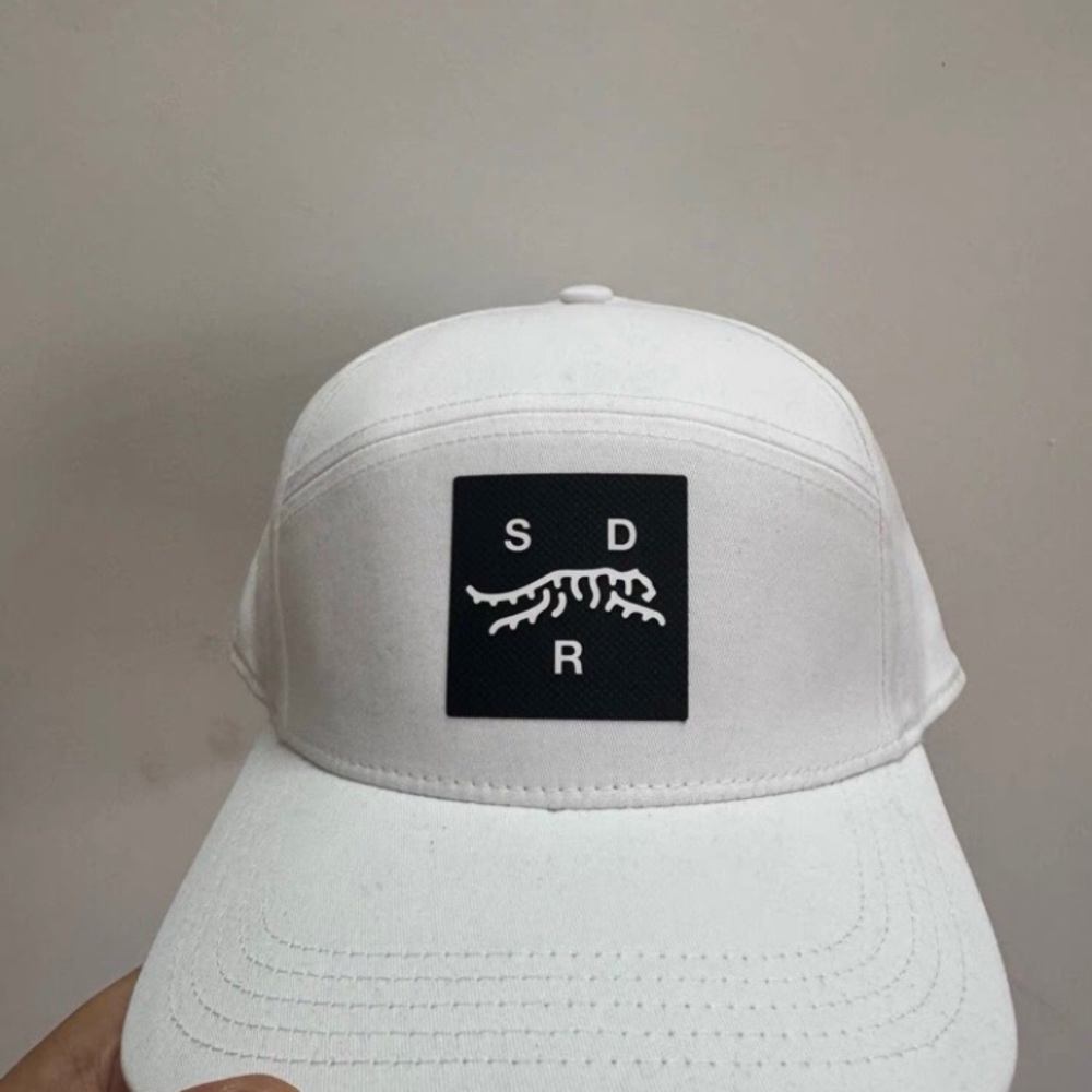 White Cap with Black Logo Patch
